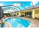 A beautiful pool with brick pavers and screened-in enclosure, offering seamless indoor-outdoor living at 16422 Rivers Reach Blvd, Parrish, FL 34219