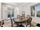 Elegant dining room adjacent to office with classic furniture, neutral paint, and warm natural light at 1911 24Th Street W Cir, Palmetto, FL 34221