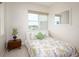 Bedroom featuring a bright window, neutral colors and a quaint nightstand at 2185 Gulf Of Mexico Dr # 245, Longboat Key, FL 34228