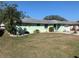 Quaint one-story single Gathering home with minimalist landscaping in the front yard at 2216 Huntington Ave, Sarasota, FL 34232