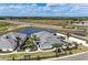 Beautiful aerial view of a well-maintained community with manicured landscaping and ponds at 260 Van Gogh Cv, Bradenton, FL 34212