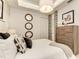Well-decorated bedroom with triple mirrors, a horse painting and neutral tones at 260 Van Gogh Cv, Bradenton, FL 34212