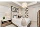 Comfortable bedroom with a stylish padded headboard and decorative wall art at 260 Van Gogh Cv, Bradenton, FL 34212
