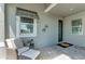 Inviting porch area with a cozy chair and tiled flooring, perfect for relaxing at 260 Van Gogh Cv, Bradenton, FL 34212