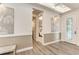 Bright foyer with wood-look floors, elegant lighting, and decorative wall trim at 260 Van Gogh Cv, Bradenton, FL 34212