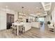 Spacious white kitchen with a large center island, stainless steel appliances, and modern lighting at 260 Van Gogh Cv, Bradenton, FL 34212