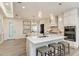 Elegant kitchen featuring white cabinetry, stainless steel appliances, and a functional island at 260 Van Gogh Cv, Bradenton, FL 34212