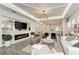 Bright living room features modern ceiling detail, stylish fireplace, and open floor plan at 260 Van Gogh Cv, Bradenton, FL 34212