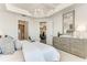 Bright main bedroom features tray ceiling, neutral decor, and ensuite bath at 260 Van Gogh Cv, Bradenton, FL 34212