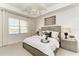 Bright main bedroom features tray ceiling, water view, and neutral decor at 260 Van Gogh Cv, Bradenton, FL 34212