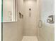 Neutral colored walk-in shower with glass door, chrome hardware, and tiled walls at 260 Van Gogh Cv, Bradenton, FL 34212
