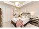 Cozy bedroom with soft carpet, a comfortable bed, and stylish decor at 264 Van Gogh Cv, Bradenton, FL 34212
