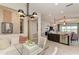 Open-concept layout with kitchen island, dining nook, and view into the kitchen and living area at 264 Van Gogh Cv, Bradenton, FL 34212