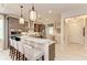 Stylish kitchen featuring a quartz countertop island with seating and stainless steel appliances at 264 Van Gogh Cv, Bradenton, FL 34212