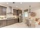 Well-lit kitchen boasts stainless steel appliances and modern gray cabinets at 264 Van Gogh Cv, Bradenton, FL 34212