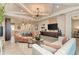 Bright open living space features modern lighting and adjacent kitchenette at 264 Van Gogh Cv, Bradenton, FL 34212