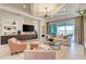 Bright living room with sliding doors to an outdoor entertainment area at 264 Van Gogh Cv, Bradenton, FL 34212