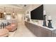 Bright living room featuring a built-in entertainment center, open layout, and modern decor at 264 Van Gogh Cv, Bradenton, FL 34212