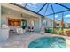 Inviting outdoor patio with a refreshing pool, comfortable seating, and scenic views at 264 Van Gogh Cv, Bradenton, FL 34212
