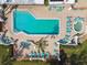 Aerial view of a sparkling pool and sundeck with lounge chairs, perfect for relaxing in the sun at 2774 71St St Ct W # 2101, Bradenton, FL 34209