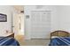 Bedroom featuring a large closet with full length shuttered doors and adjacent bathroom at 2774 71St St Ct W # 2101, Bradenton, FL 34209