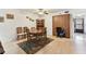 Dining room with seating for six, hardwood floors, ceiling fan, and a built in hutch at 2774 71St St Ct W # 2101, Bradenton, FL 34209