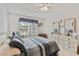 Well-lit main bedroom with a large window, ceiling fan, and plenty of storage space at 2774 71St St Ct W # 2101, Bradenton, FL 34209