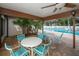 Covered patio with seating area offers a relaxing space near the community pool at 2774 71St St Ct W # 2101, Bradenton, FL 34209