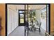 Sunroom with seating for four, a ceiling fan, and a sliding glass door to the backyard at 2774 71St St Ct W # 2101, Bradenton, FL 34209
