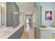Stylish bathroom with double sink vanity, walk-in shower, and modern lighting at 279 Park Forest Blvd, Englewood, FL 34223