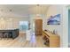 Bright foyer with wood floors, decorative lighting, and a view of the kitchen island at 279 Park Forest Blvd, Englewood, FL 34223