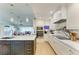 Modern kitchen with an island, stainless steel appliances, and open design, great for socializing at 279 Park Forest Blvd, Englewood, FL 34223