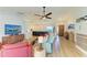 Comfortable living room offering wood floors and an open layout leading to the kitchen island at 279 Park Forest Blvd, Englewood, FL 34223