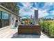 Cozy outdoor patio featuring a wicker sofa, patio furniture and a serene backyard view at 279 Park Forest Blvd, Englewood, FL 34223