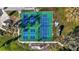 Aerial shot of well-maintained community pickleball courts with green and blue surfaces at 279 Park Forest Blvd, Englewood, FL 34223