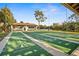 Community shuffleboard courts with a lakeside picnic area and a covered patio at 279 Park Forest Blvd, Englewood, FL 34223