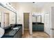 Spacious bathroom features a double vanity, granite countertops, and travertine tile flooring at 310 79Th Nw St, Bradenton, FL 34209