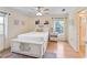 Bedroom with natural light, hardwood floors, and ensuite bathroom at 310 79Th Nw St, Bradenton, FL 34209