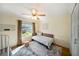Cozy bedroom with ceiling fan, daybed, and a large window at 310 79Th Nw St, Bradenton, FL 34209