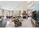 Bright, open living area featuring a fireplace, comfortable seating, and access to outdoor dining at 310 79Th Nw St, Bradenton, FL 34209
