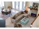 Bright living area with a fireplace, comfortable seating, and access to the outdoors at 310 79Th Nw St, Bradenton, FL 34209