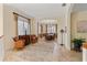 Living room showcasing tile flooring, decorative rug, and view into formal dining room at 310 79Th Nw St, Bradenton, FL 34209