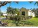 Attractive one-story home with lush landscaping, large trees, and manicured lawn, creating excellent curb appeal at 3116 Woodland Fern Dr, Parrish, FL 34219
