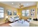 Inviting living room with comfortable seating, stylish decor, and natural light at 3116 Woodland Fern Dr, Parrish, FL 34219