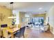 Open-concept living space with ample natural light, comfortable seating, and view to the lanai offers a relaxed atmosphere at 3116 Woodland Fern Dr, Parrish, FL 34219
