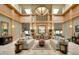 Elegant clubhouse lobby boasts high ceilings, comfortable seating, and stylish decor at 3116 Woodland Fern Dr, Parrish, FL 34219