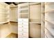 Spacious walk-in closet with custom shelving and ample storage space at 3116 Woodland Fern Dr, Parrish, FL 34219