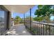 Exterior patio showcasing a deck with railings, offering outdoor space and views at 4003 Bayside Dr, Bradenton, FL 34210