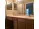 Bathroom featuring a light-colored vanity with double sinks and a large mirror at 4008 Crockers Lake Blvd # 11, Sarasota, FL 34238