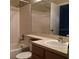 Bathroom with a tub, shower, light tile, and a large mirror at 4008 Crockers Lake Blvd # 11, Sarasota, FL 34238